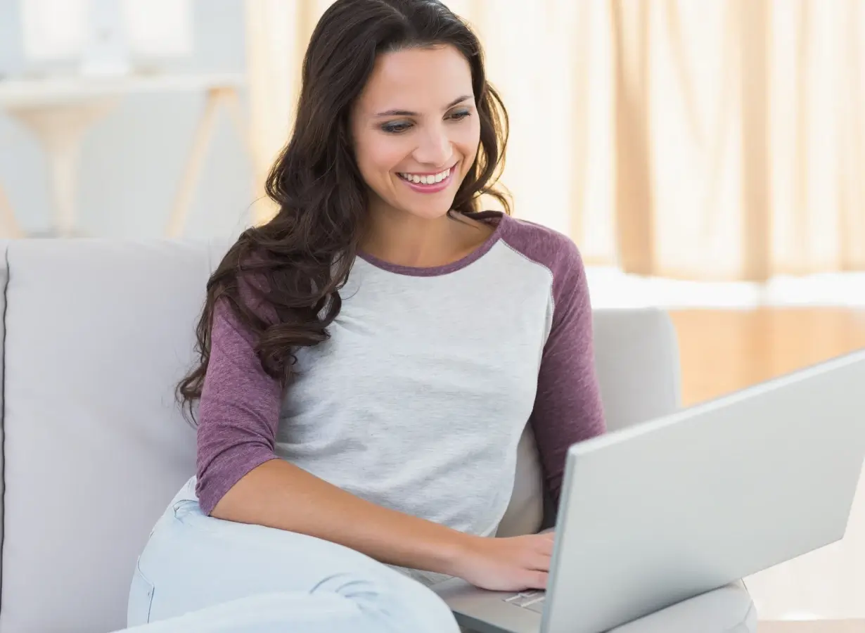 Lady browsing her laptop image