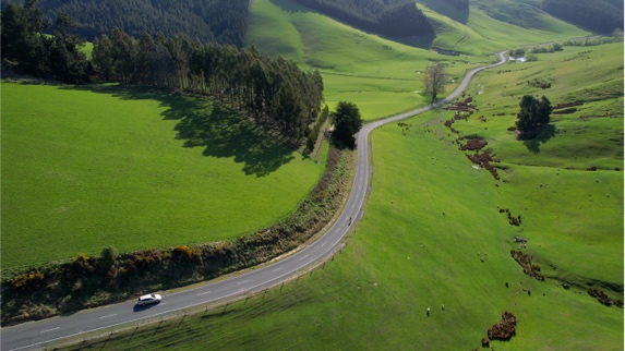 Car driving down road